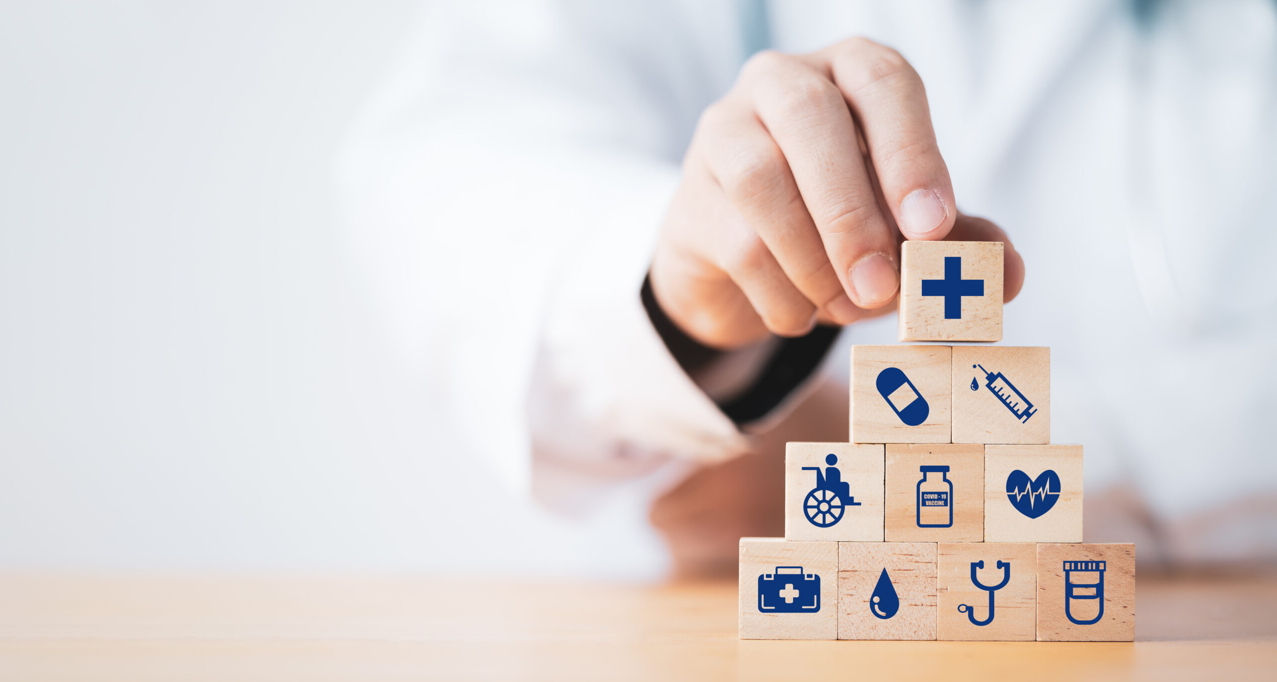 Doctor putting and stacking wooden block cube which print screen